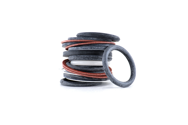 A detailed shot of a stack of assorted o-rings, showcasing mechanical parts and components.