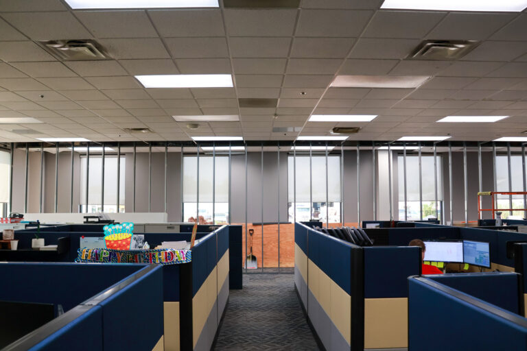 New metal wall framing spans a Sealing Devices office area during interior construction.